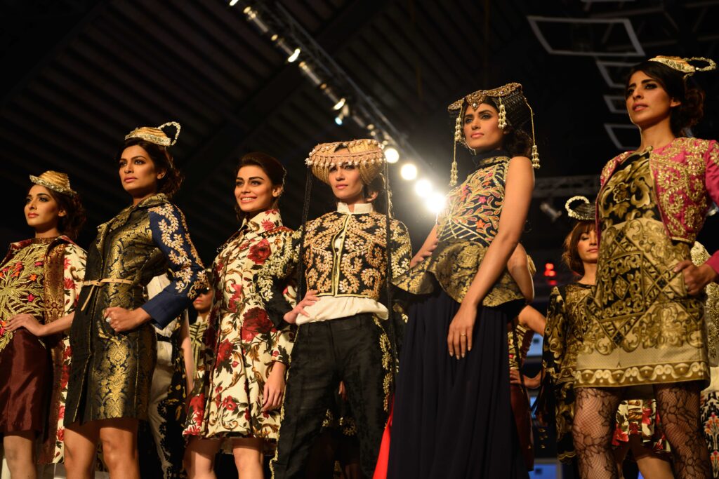 Models including Sadaf Kanwal, posing on the last catwalk of the ramp during PFDC's Fashion Show held in Lahore.  